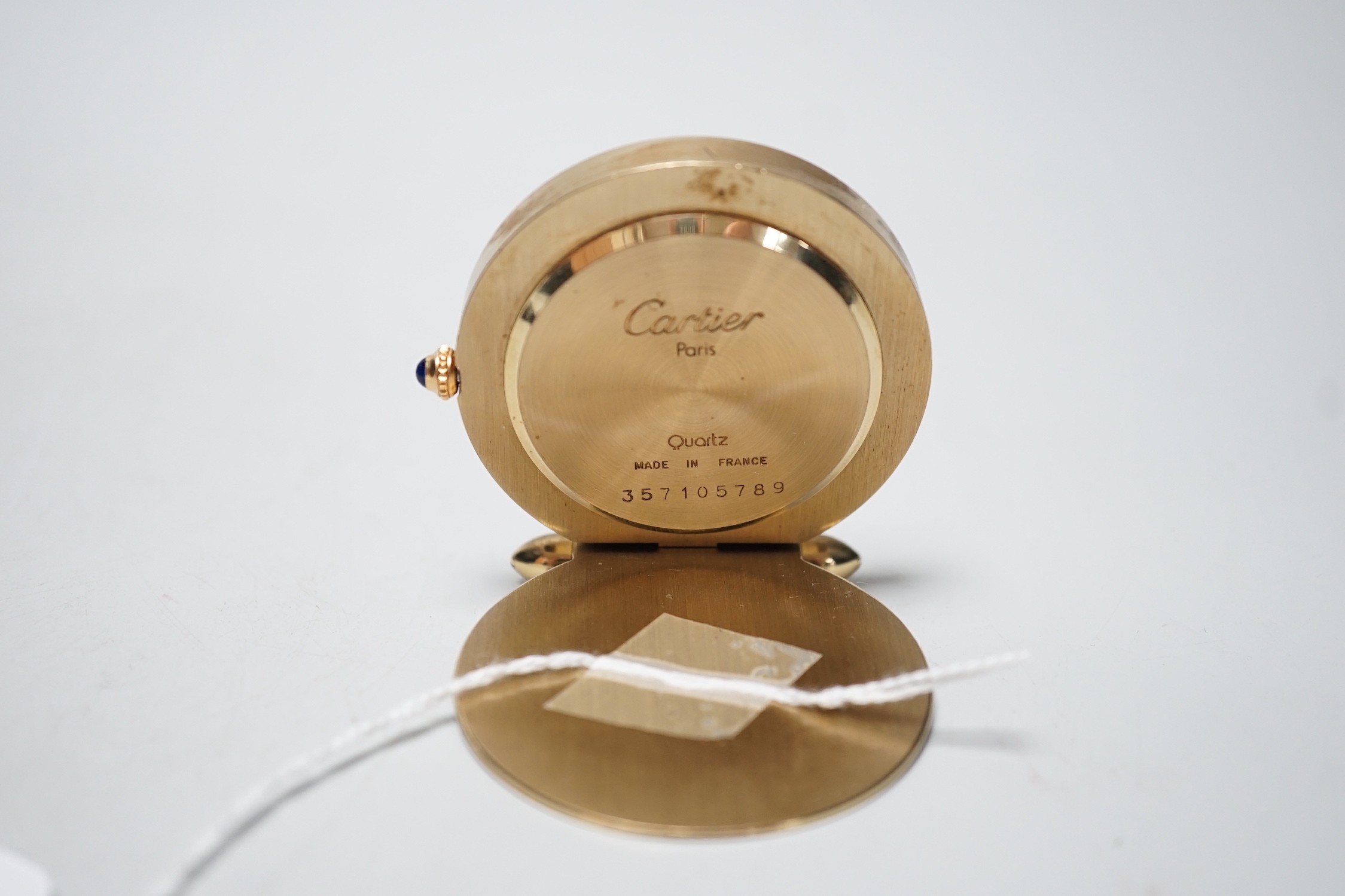 A Cartier travelling alarm timepiece, serial number 357105789